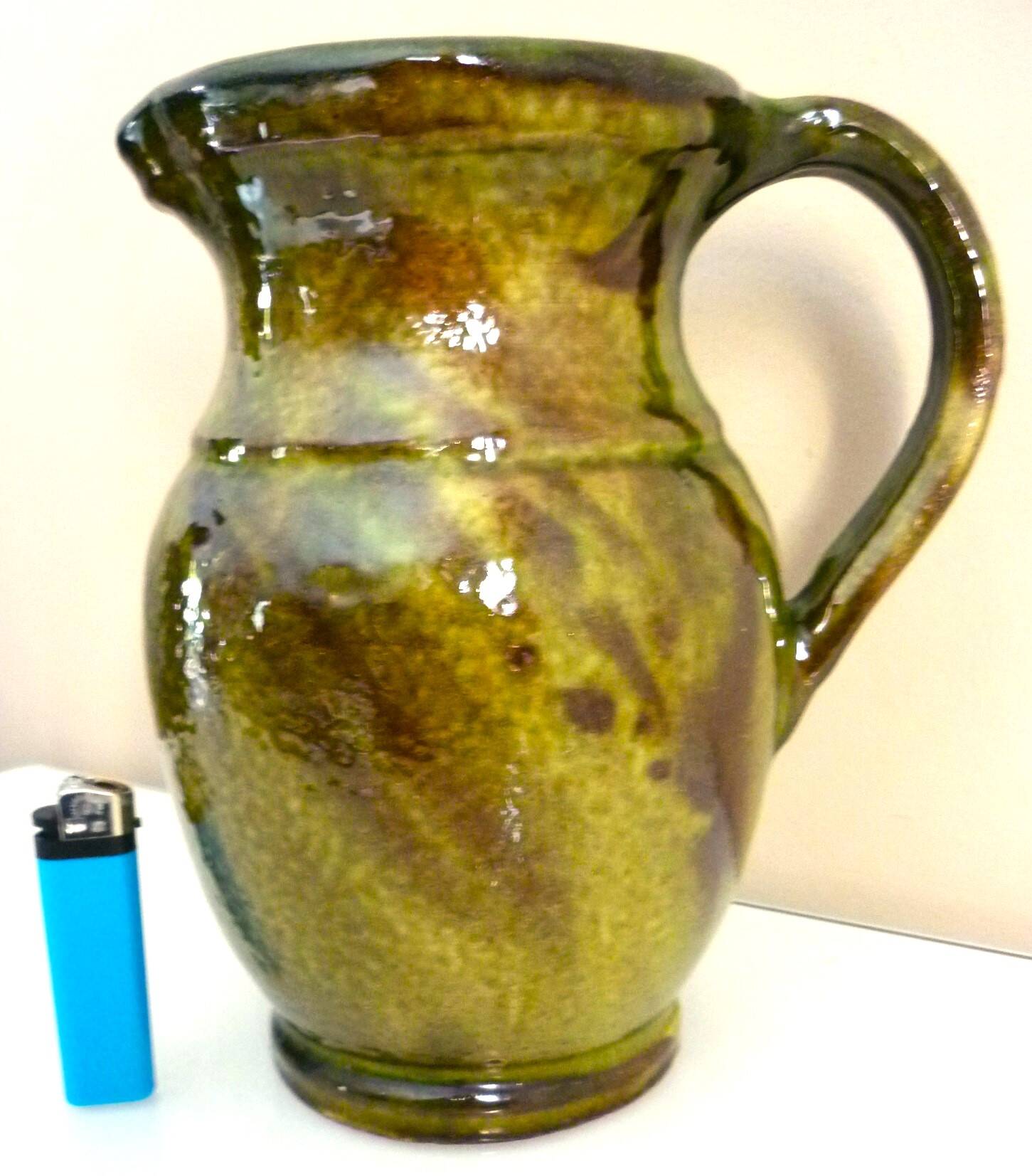 Pitcher vase, thick green glazed terracotta, signature to be identified