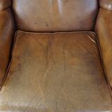 Charming sheep leather wingback armchair with a beautiful patina and excellent seating comfort