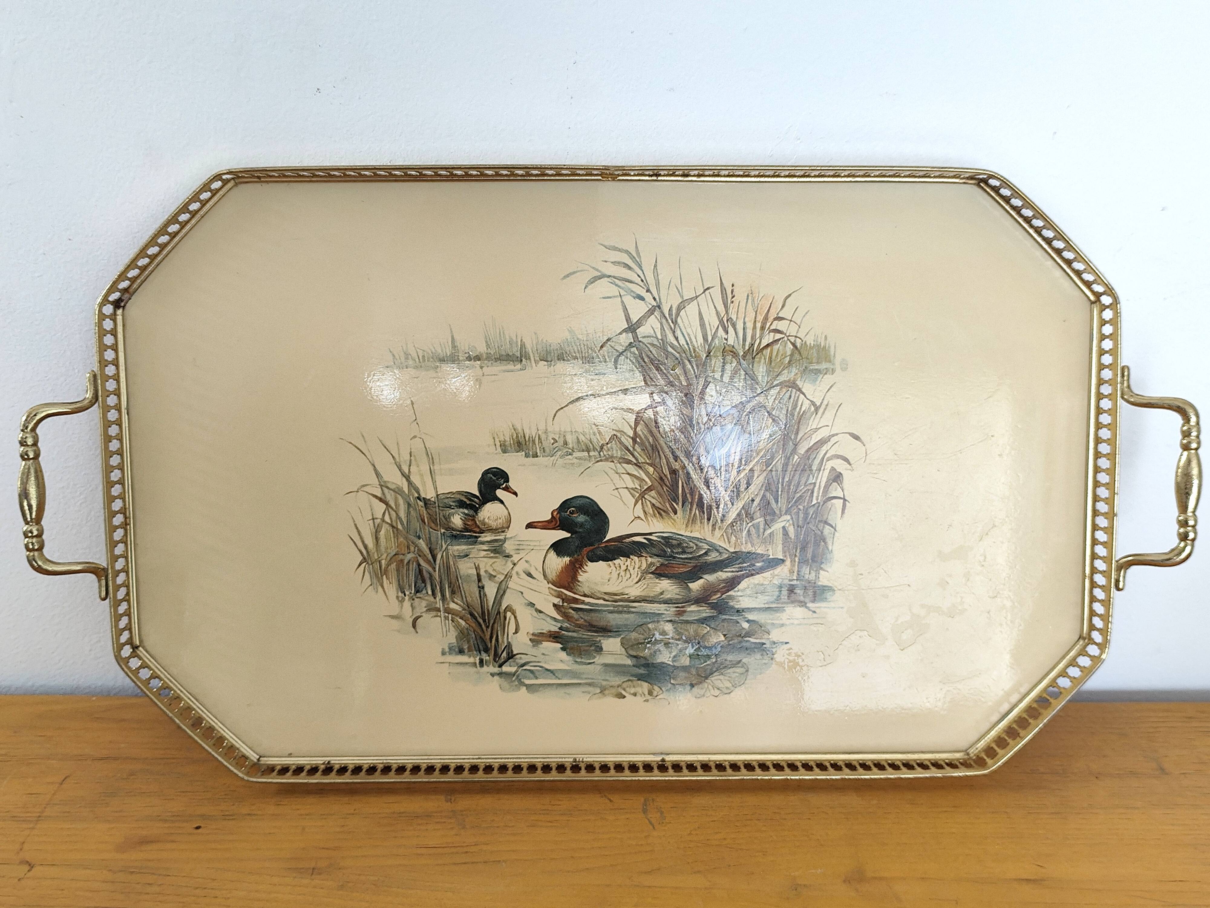 Vintage service tray with a golden gallery and mirror, decorated with ducks.