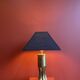 Brass shell socket lamp from the 1st WW, black pyramidal lampshade in Carlucci linen.