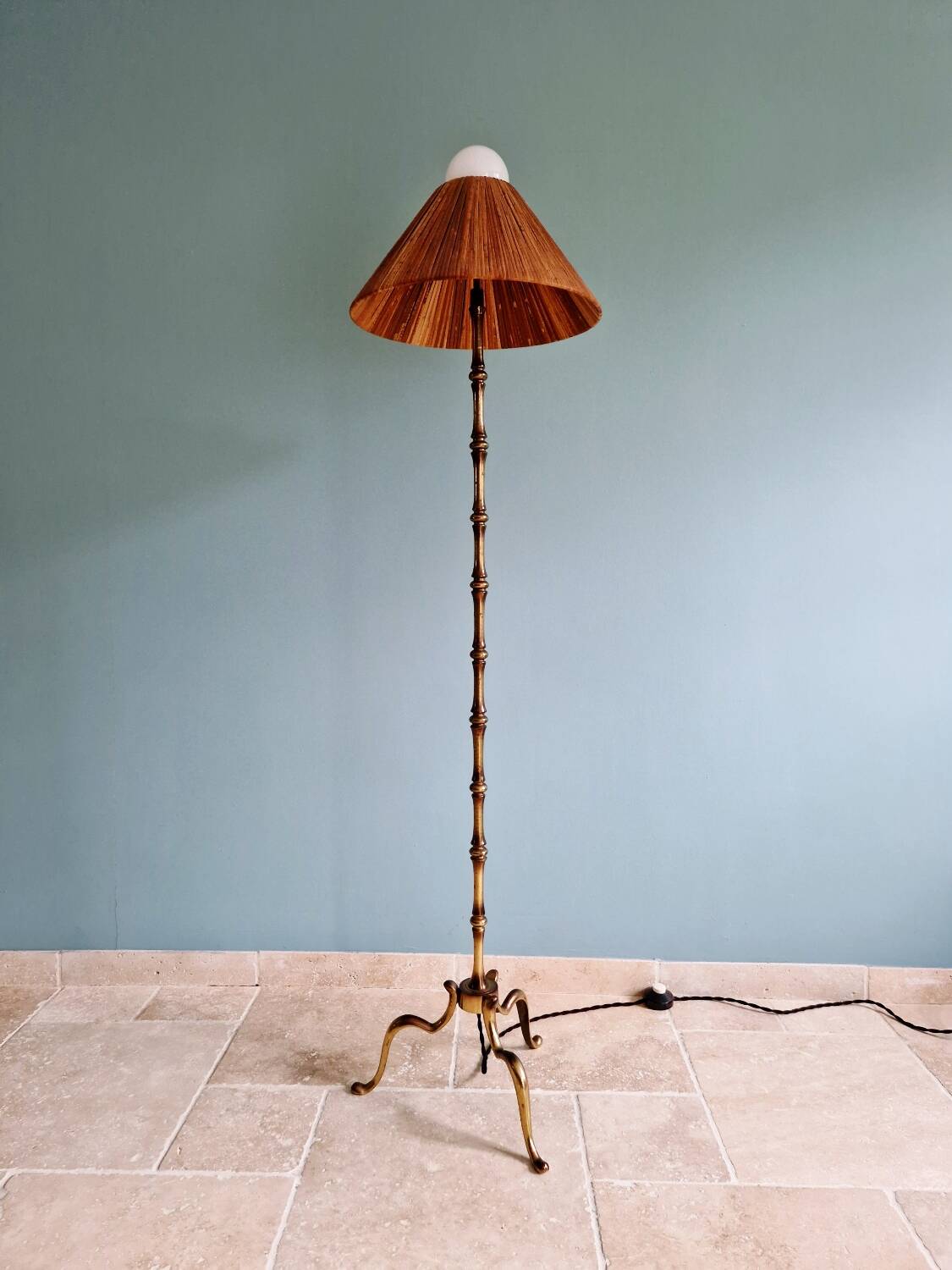 Brass floor lamp with rattan shade, 1950s-60s.