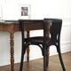 Curved black lacquered wooden armchair in Thonet style