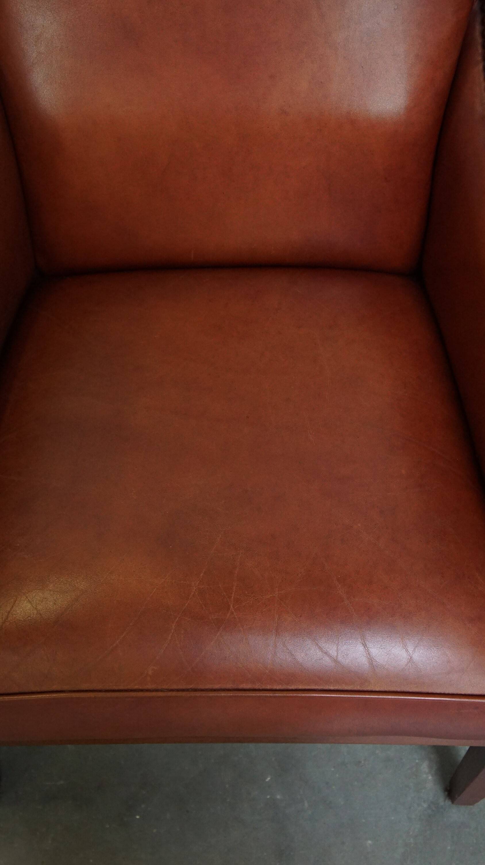 Ensemble majestueux et luxueux de 4 fauteuils design Art Déco en cuir de vachette couleur cognac