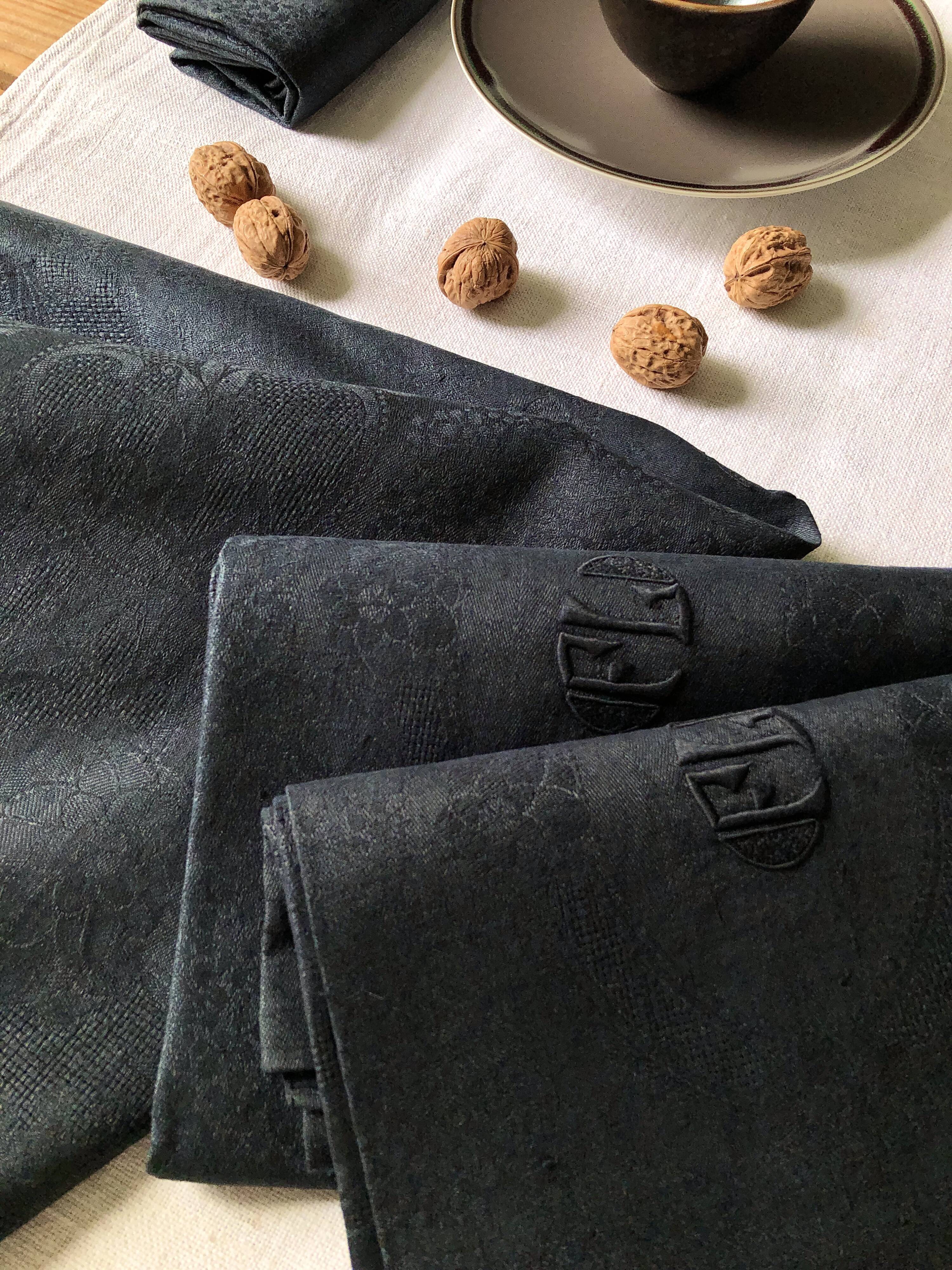 Set of four old damasked towels tinted black