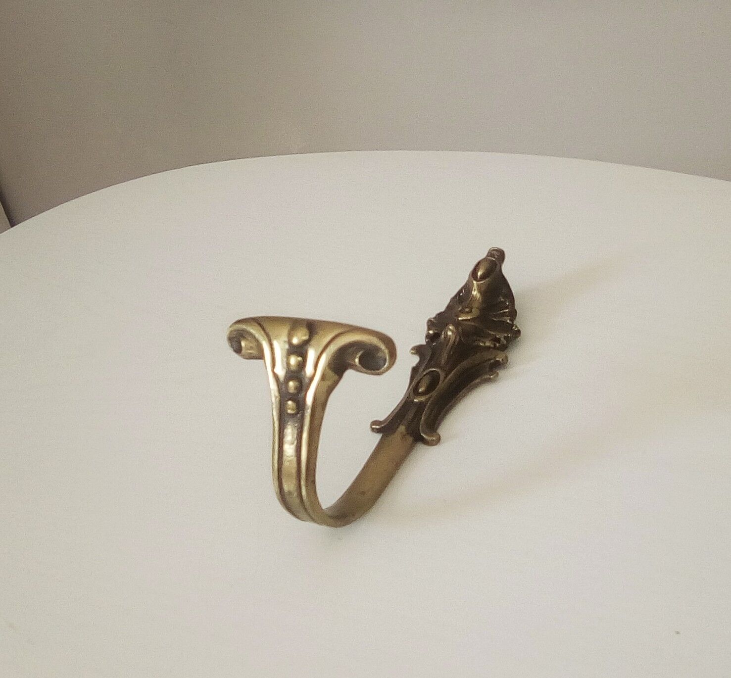Old brass coat rack hook