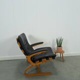Fauteuil de lecture noir avec accoudoirs et support en bois