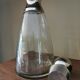 Old glass and silver metal carafe