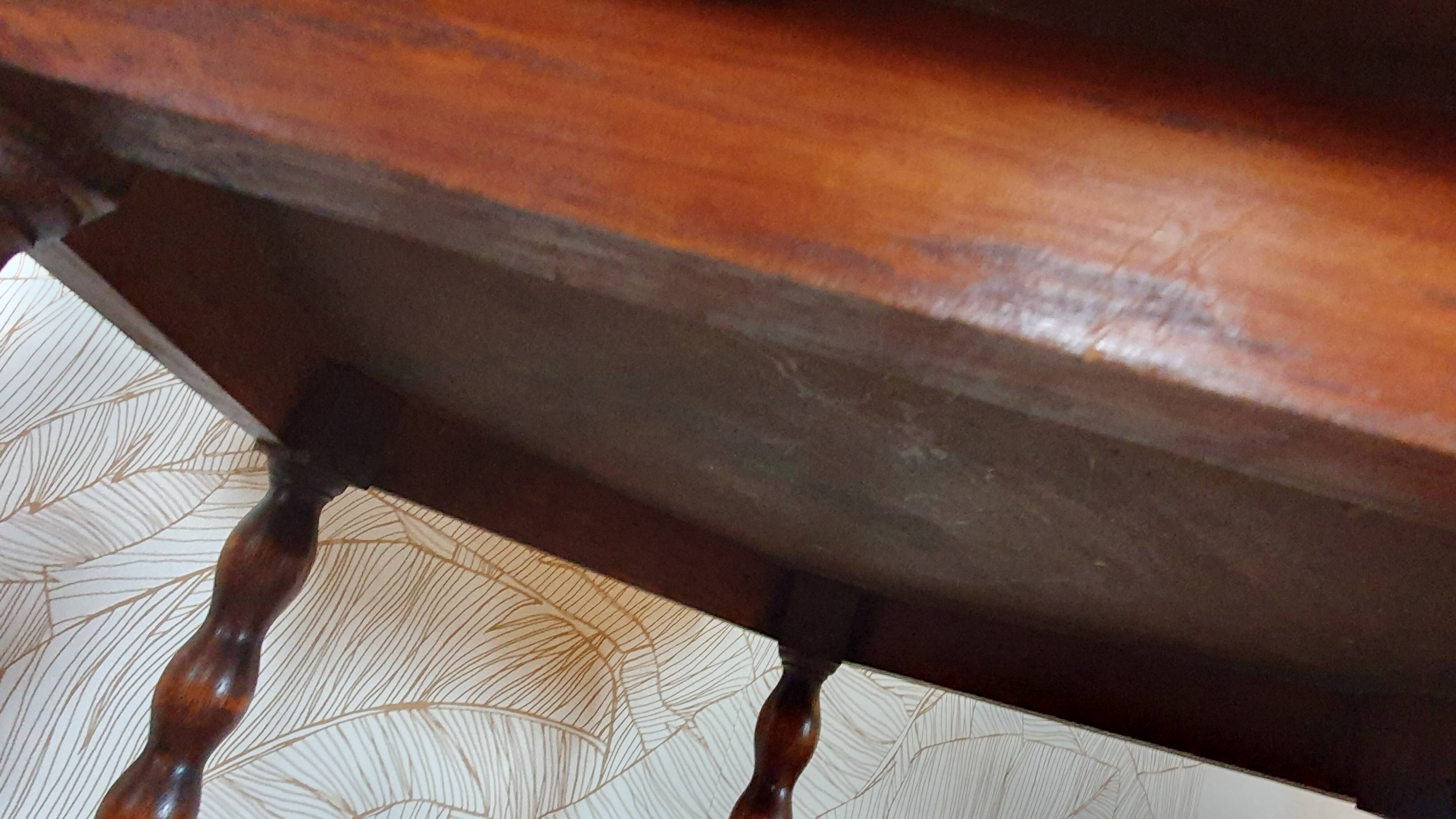 Round wooden table with beaded legs
