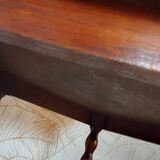 Round wooden table with beaded legs