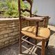 Antique Provençal armchair in wood with a straw seat.