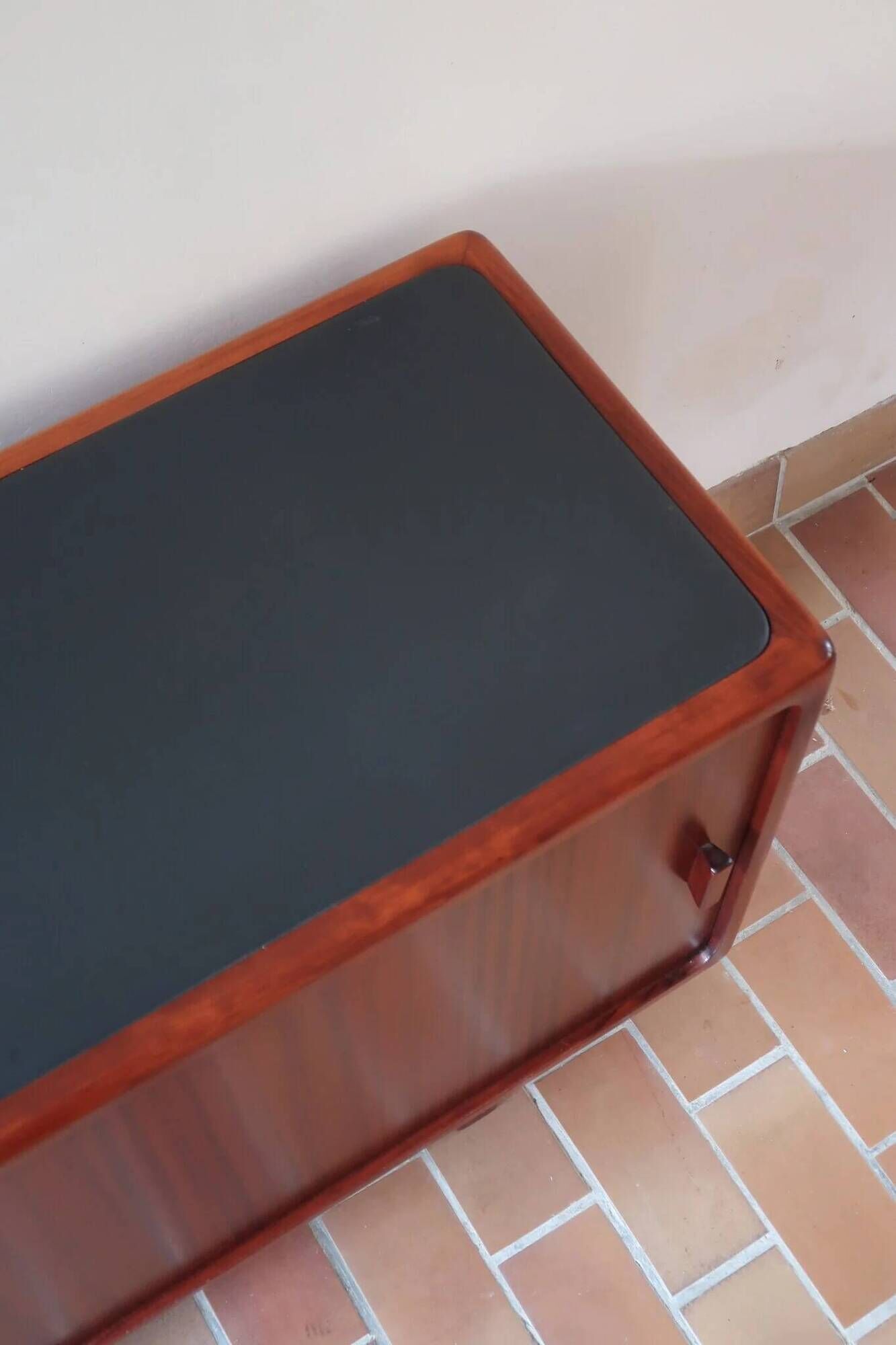 Teak enfilade, sliding doors, black faux leather top, 1970s.
