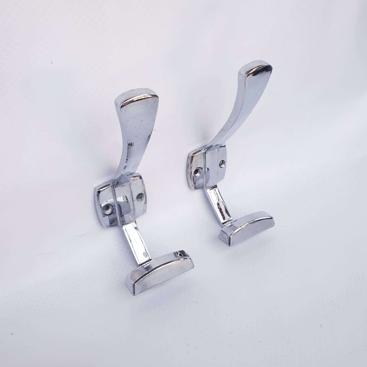 Pair of vintage chrome metal wall hooks