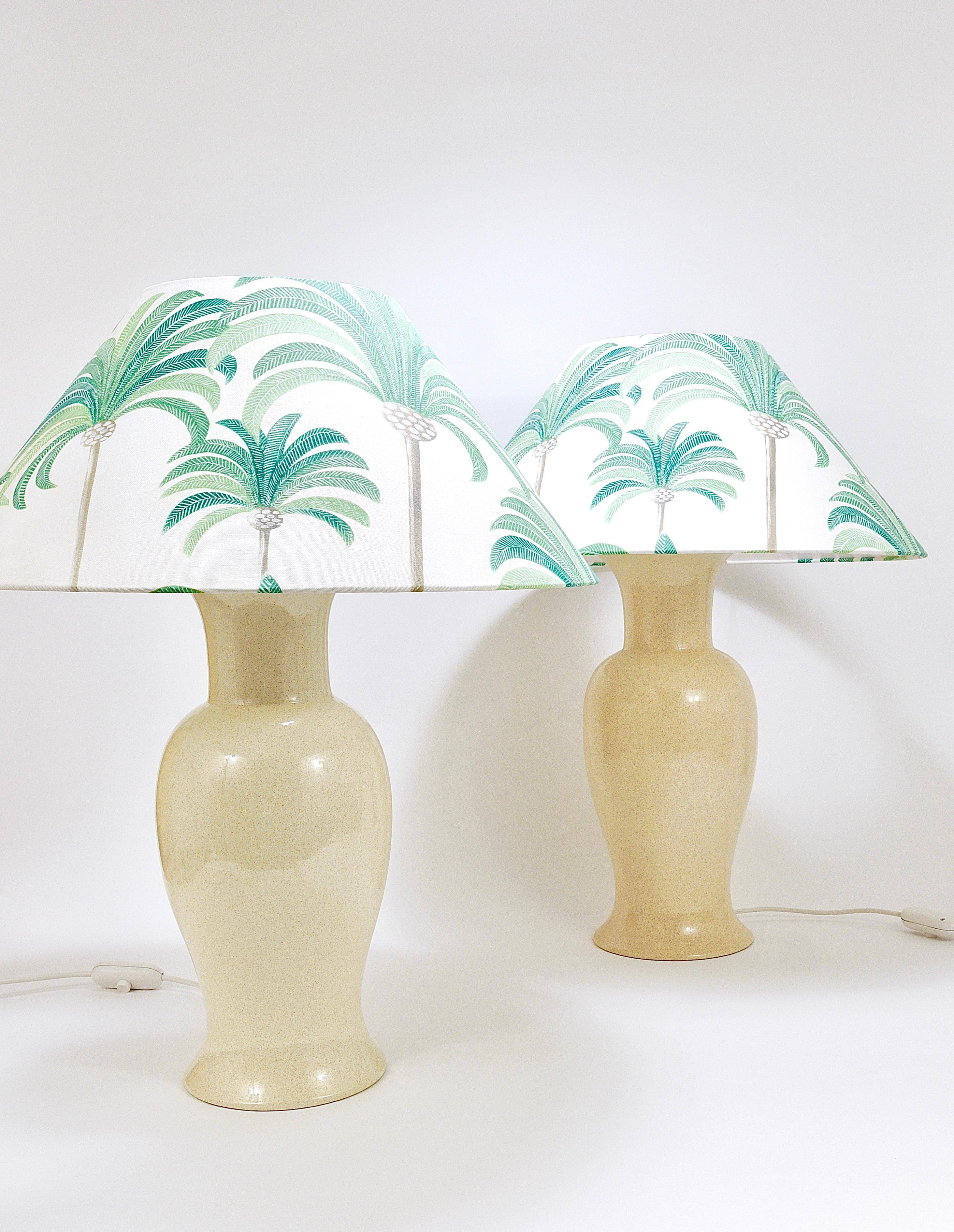 Pair of Tommaso Barbi Riviera palm tree table lamps from the 1970s with matching cushions.