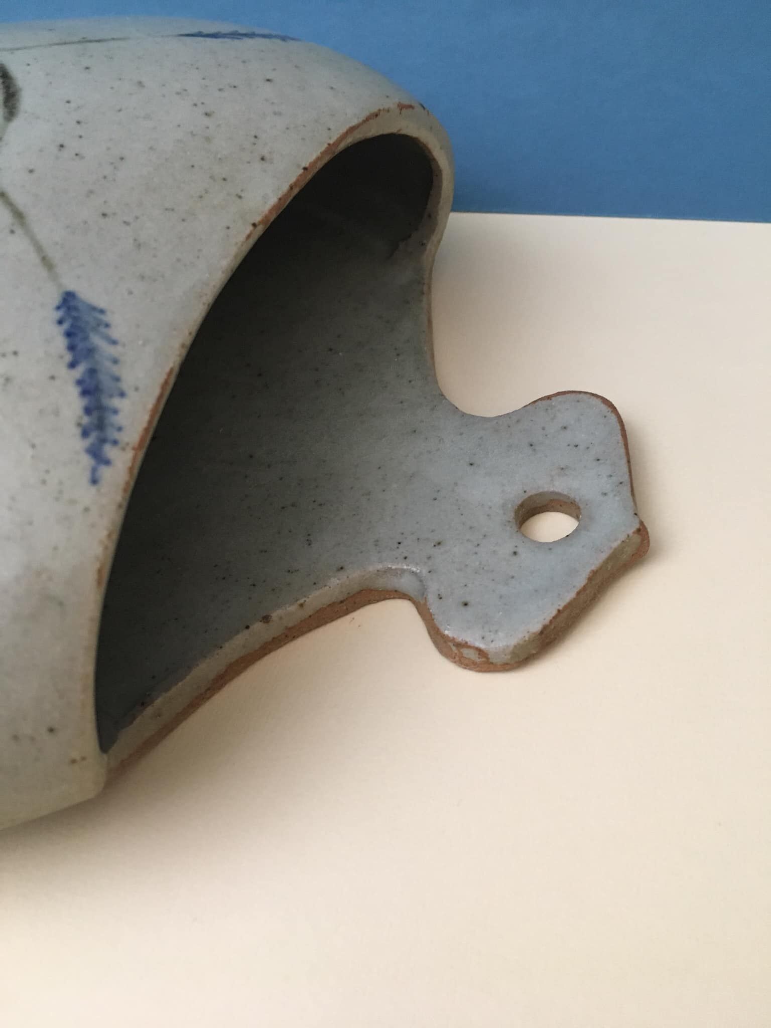 Ceramic wall plant holder with floral motifs, unknown signature