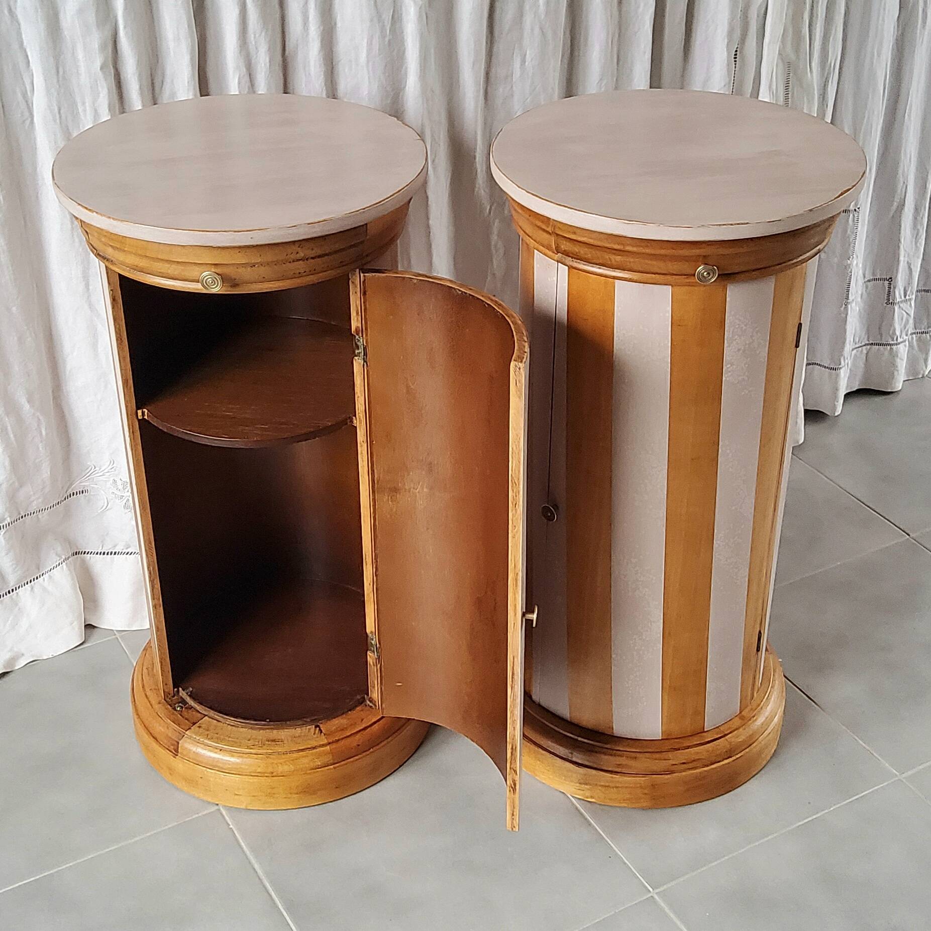 A pair of distressed bedside tables.
