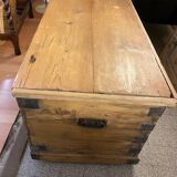 Old trunk in natural pine wood with padded interior