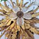 Flower wall light, gilded metal and glass cabochons, attributed to Baguès.