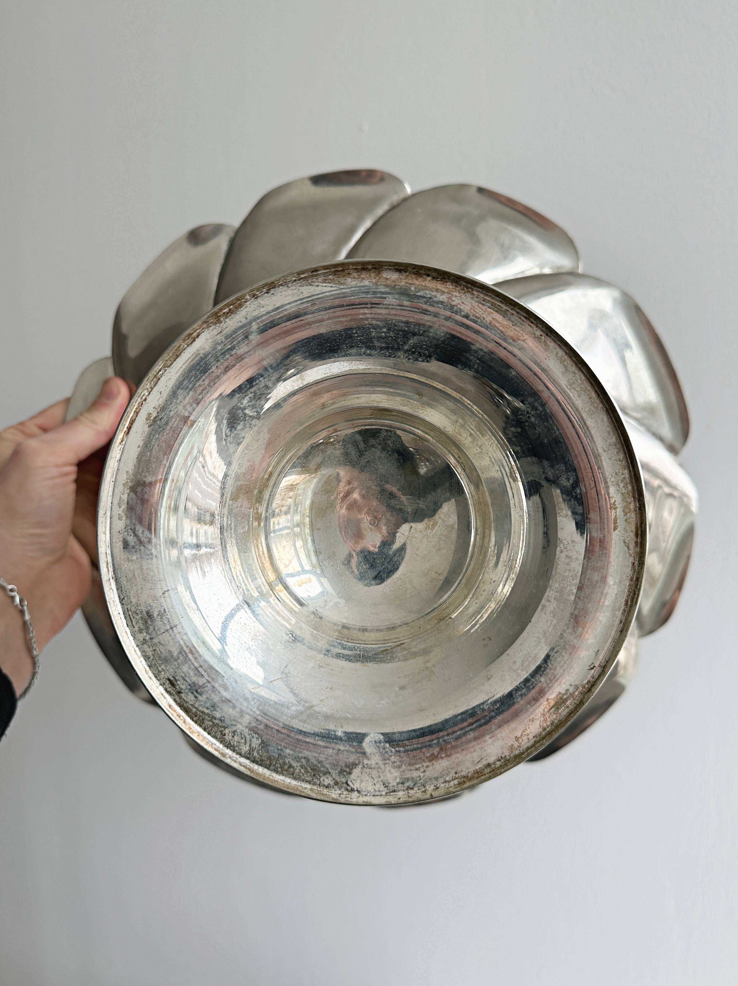 large dish on a shiny metal stand