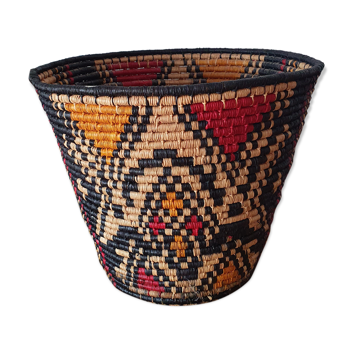 Ethnic basket in multicolored braided straw