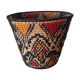 Ethnic basket in multicolored braided straw
