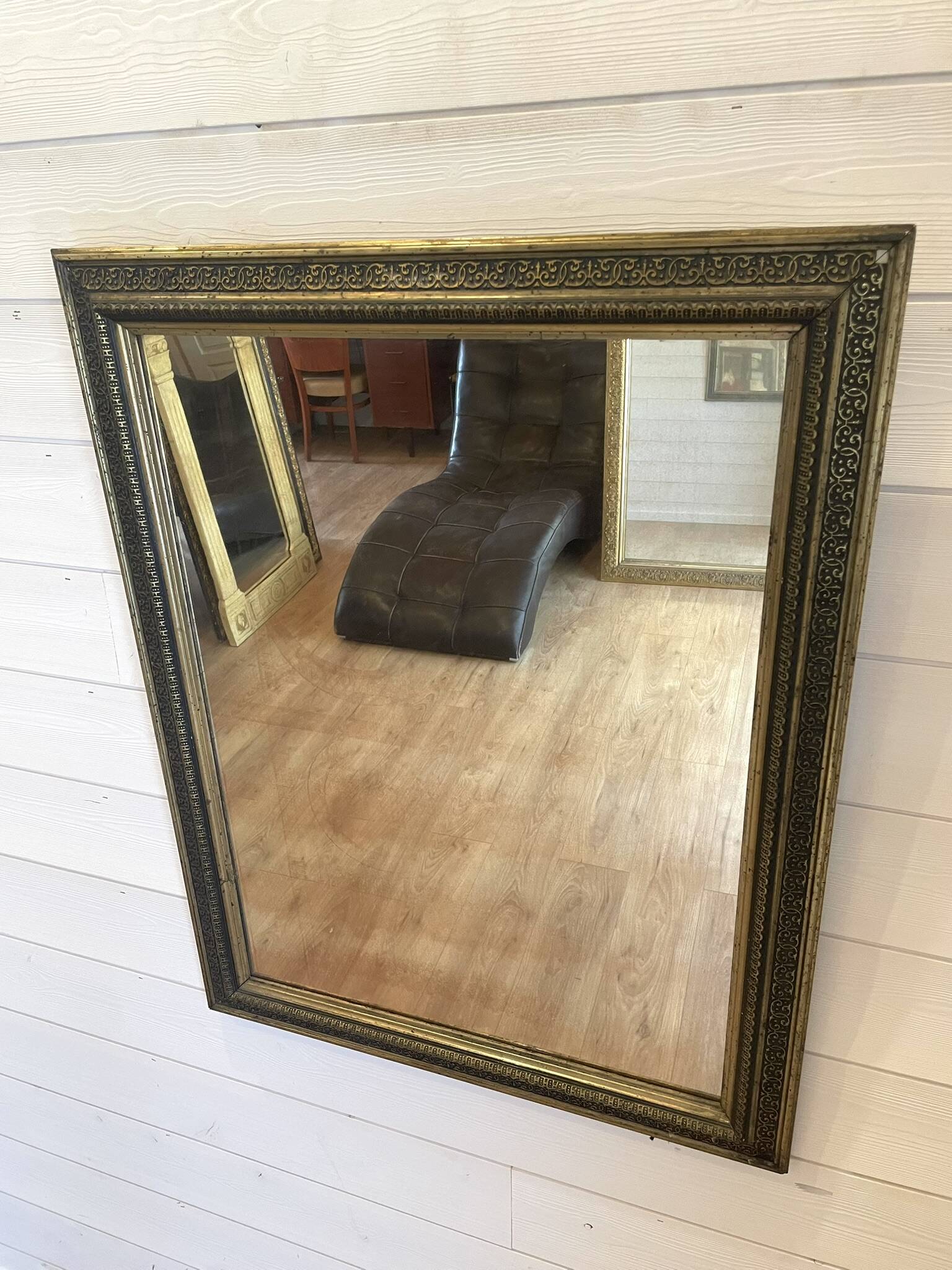 Large gilded antique mirror with moulding in the Napoléon III style.