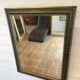 Large gilded antique mirror with moulding in the Napoléon III style.