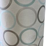 Vintage ceramic floor lamp with illuminated base.