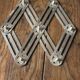 Vintage folding metal trivet