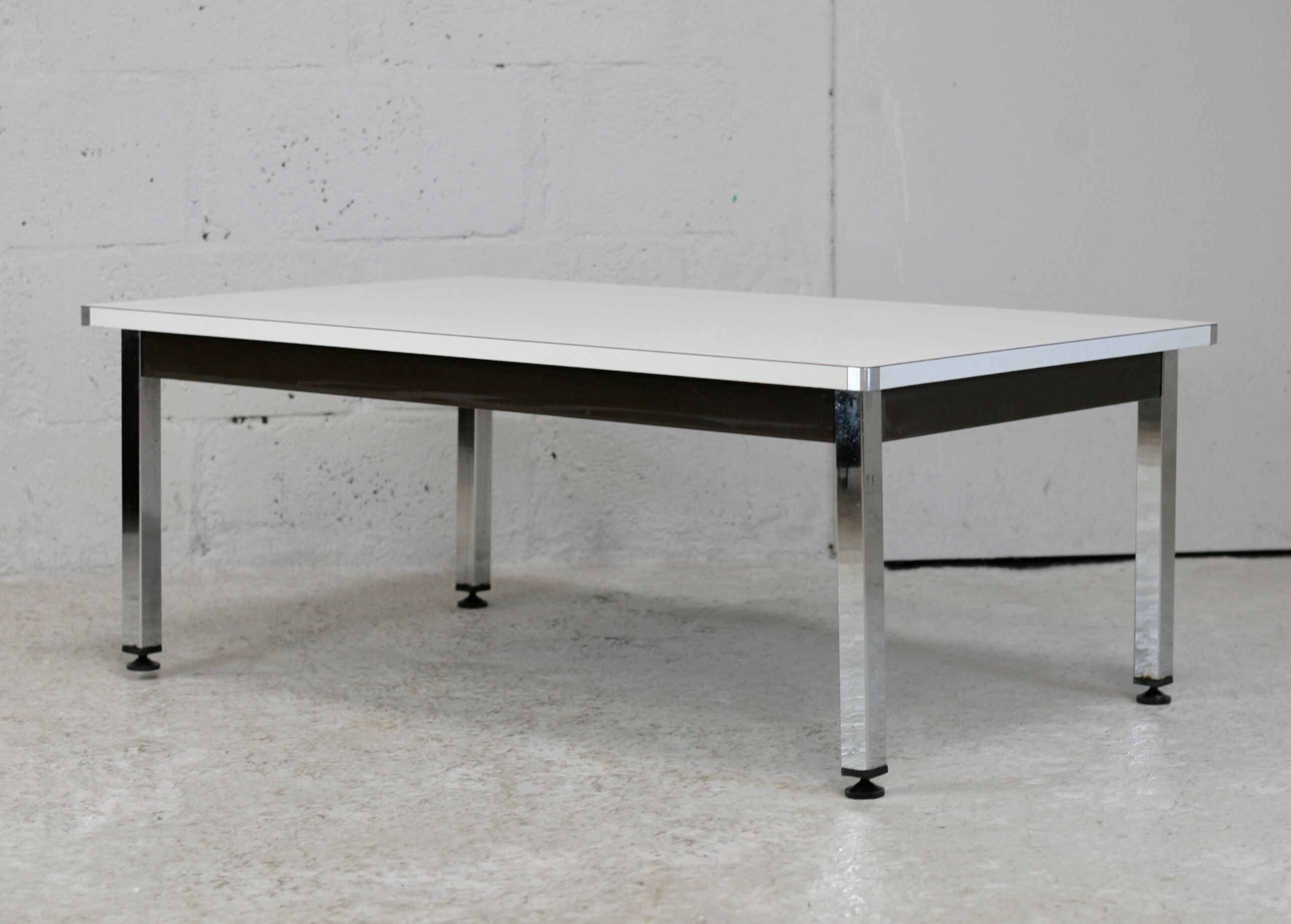 Coffee table chrome steel base, white melaminate top. France, circa 1970.