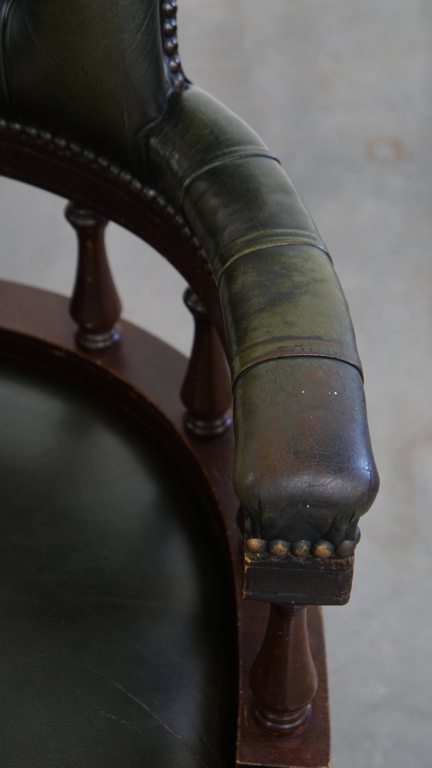 Adjustable green leather and wood Chesterfield office chair with swivel