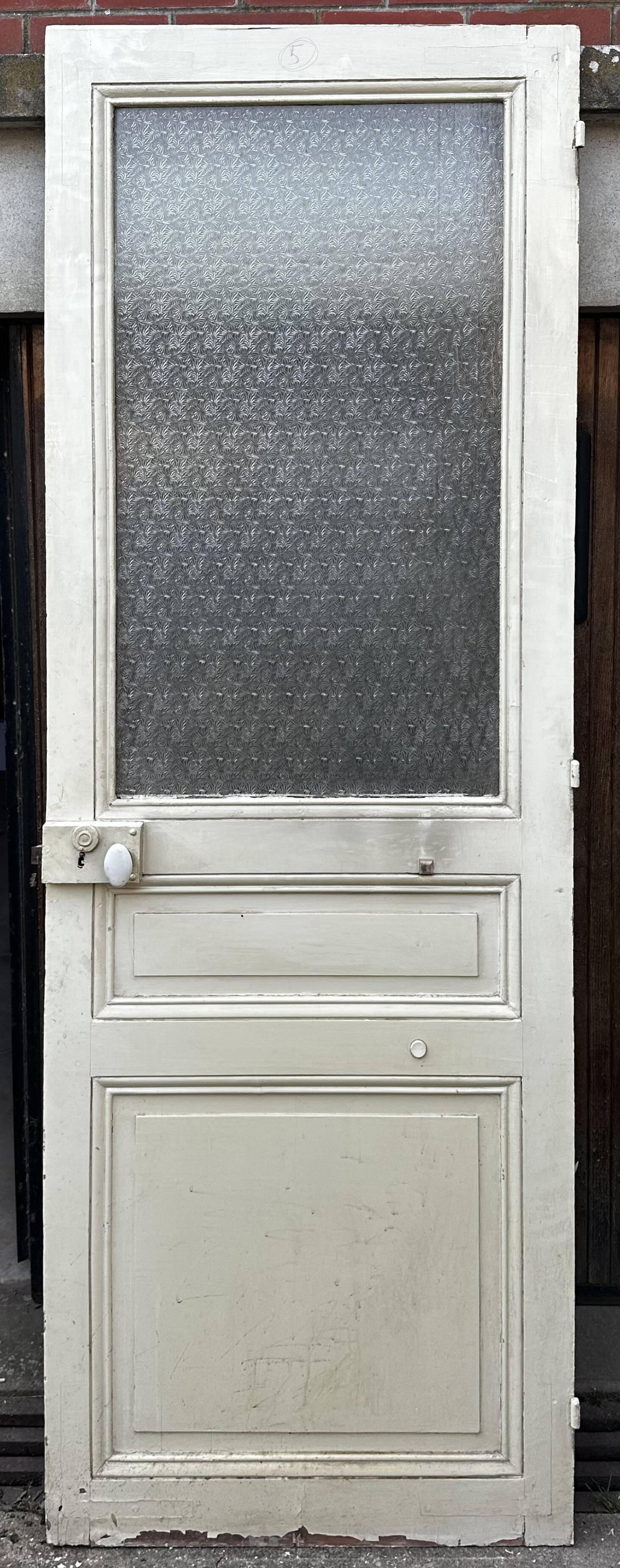 Old door from 1890 in solid wood with translucent glass at the top