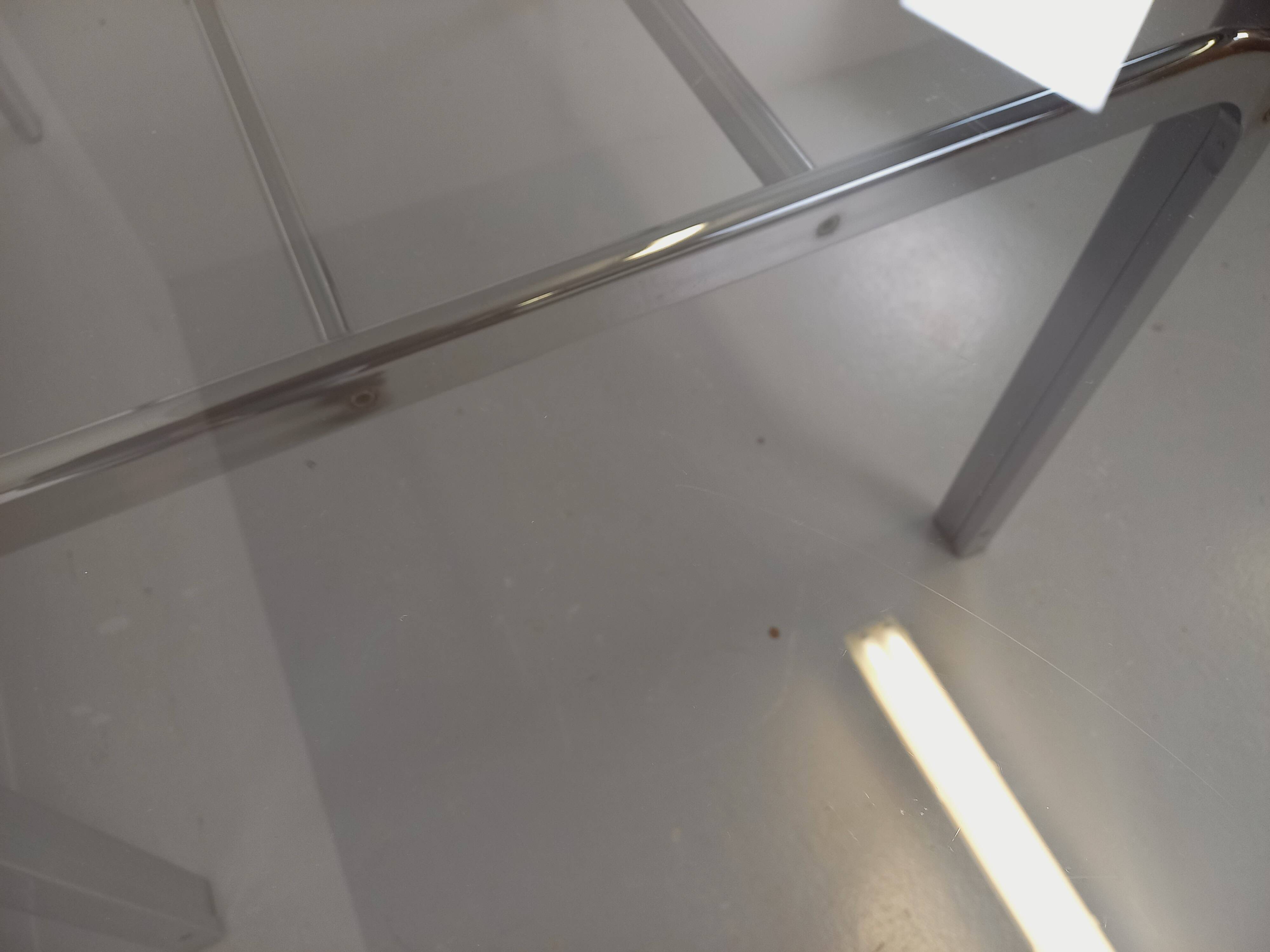 Vintage oval dining table in smoked glass and chrome metal, Space Age style.