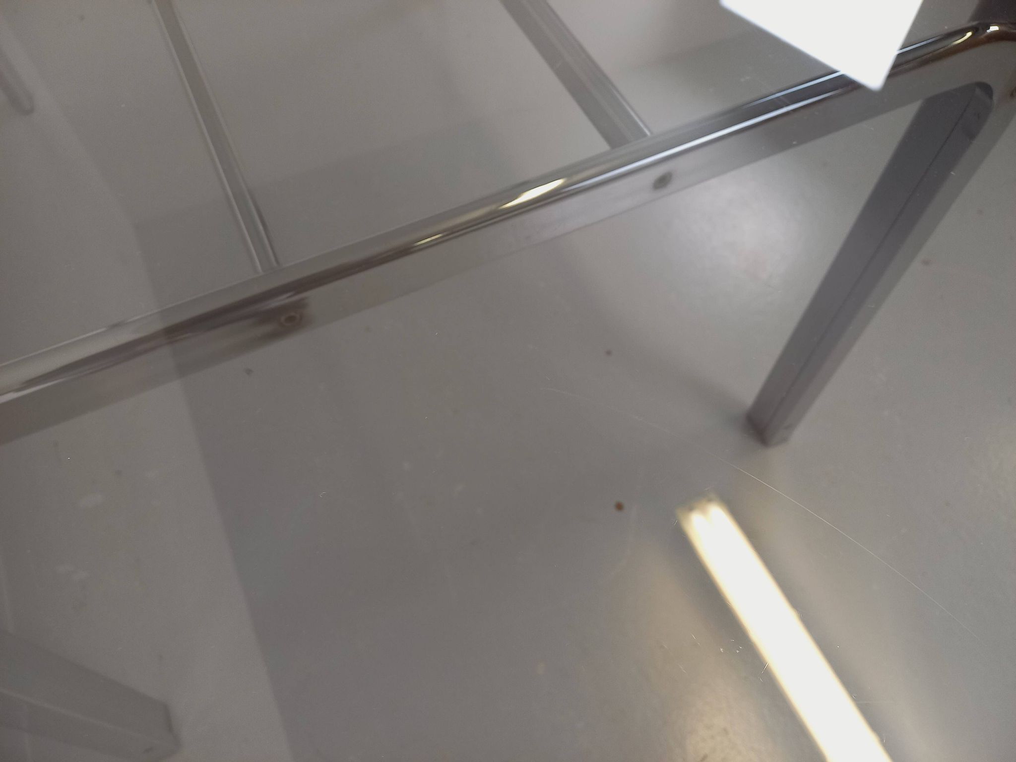 Vintage oval dining table in smoked glass and chrome metal, Space Age style.