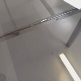 Vintage oval dining table in smoked glass and chrome metal, Space Age style.