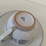 Glazed earthenware cups and saucers