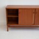 Modern mid-century teak sideboard with brass details.