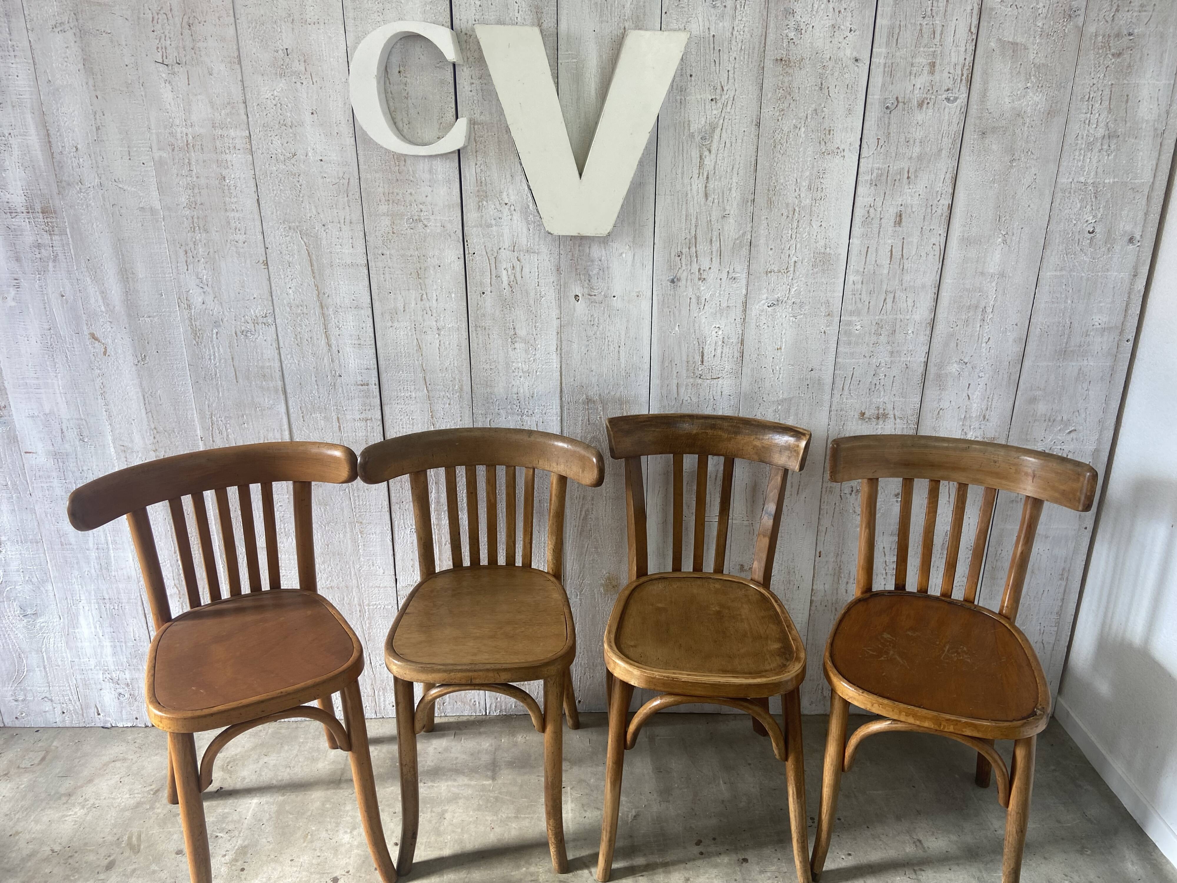 Mismatched curved wood bistro chairs (Fischel..)