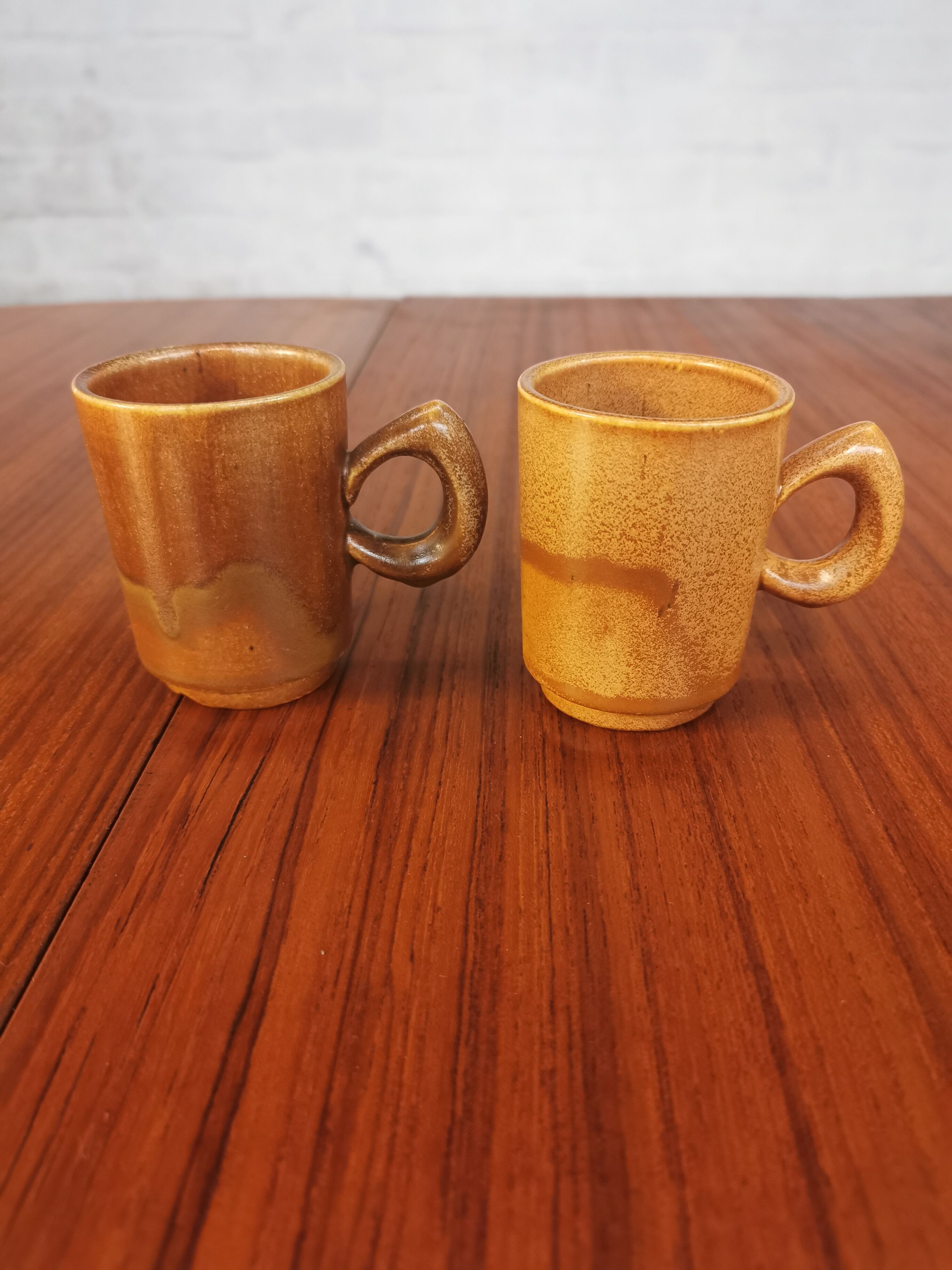 Duo of vintage stoneware cups