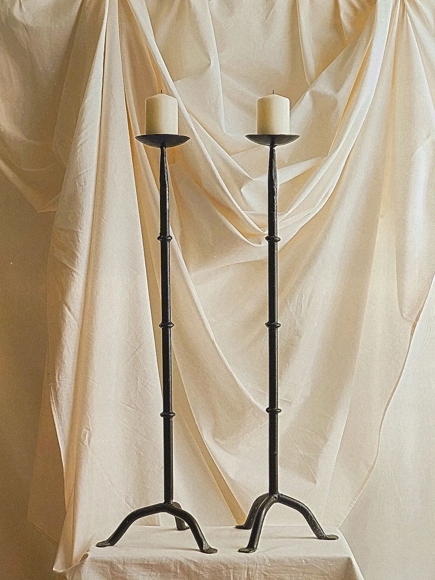Pair of black cast iron floor candlesticks (candle holders)