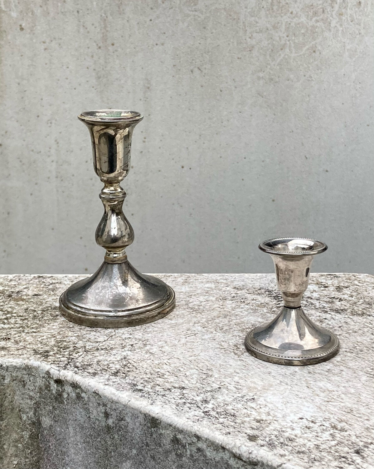 Two antique candle holders