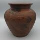 Vase or pot in brown terracotta with artistic decoration of fish.