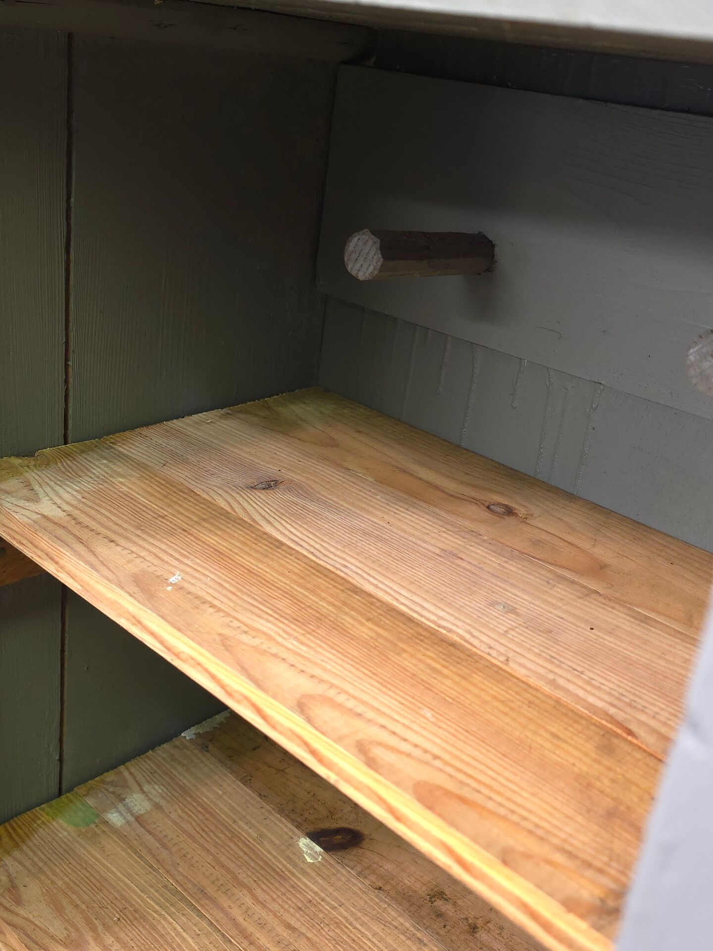 Curved wardrobe workshop locker made of wood repainted in grey.