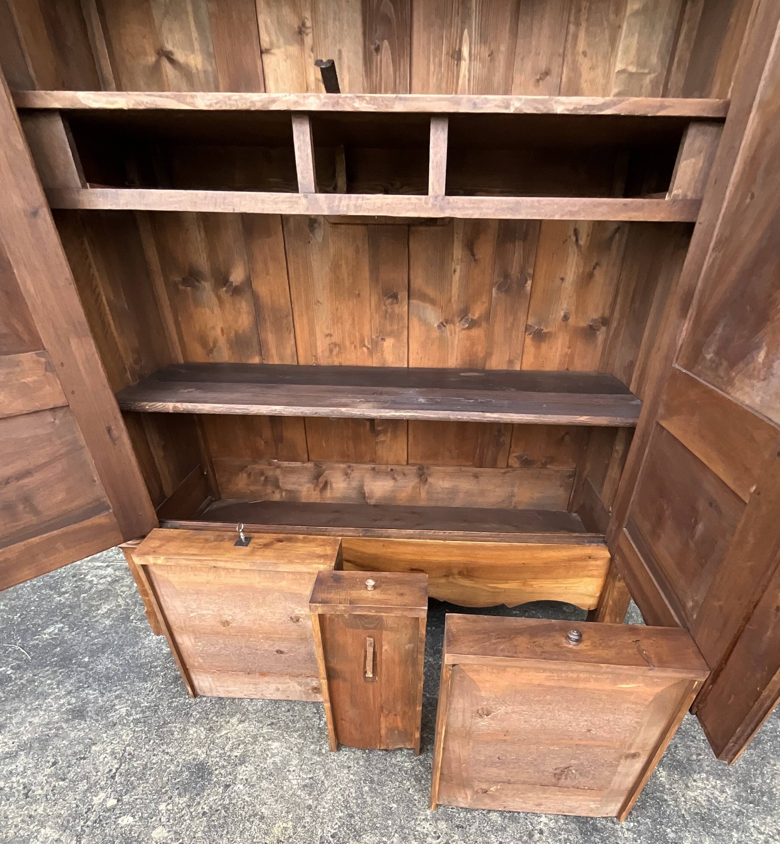 Empire wardrobe in solid walnut, France, mid-19th century.