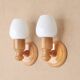 Pair of pine wood and white glass wall lights, 1970s