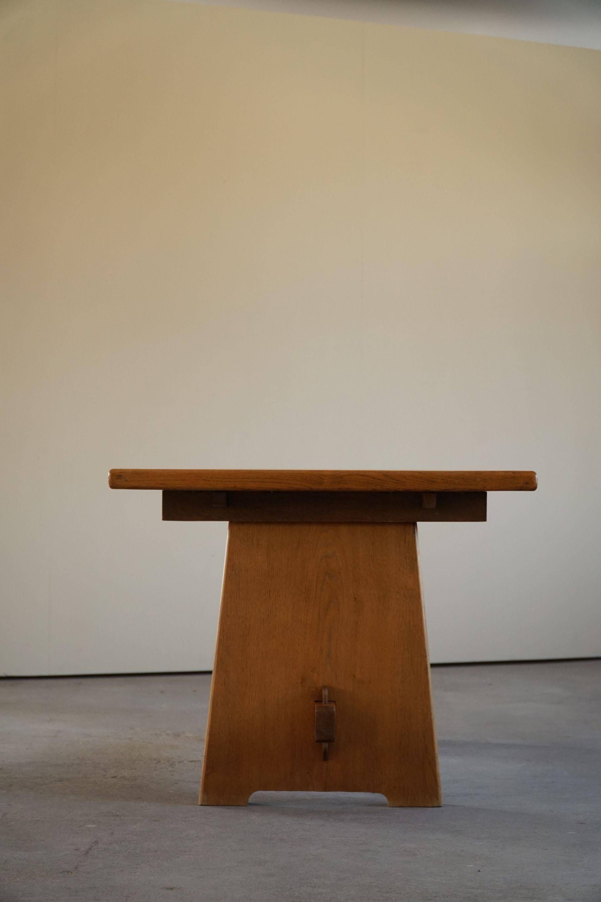 Mid-century brutalist dining table, made of oak, Danish craftsmanship, 1950s.