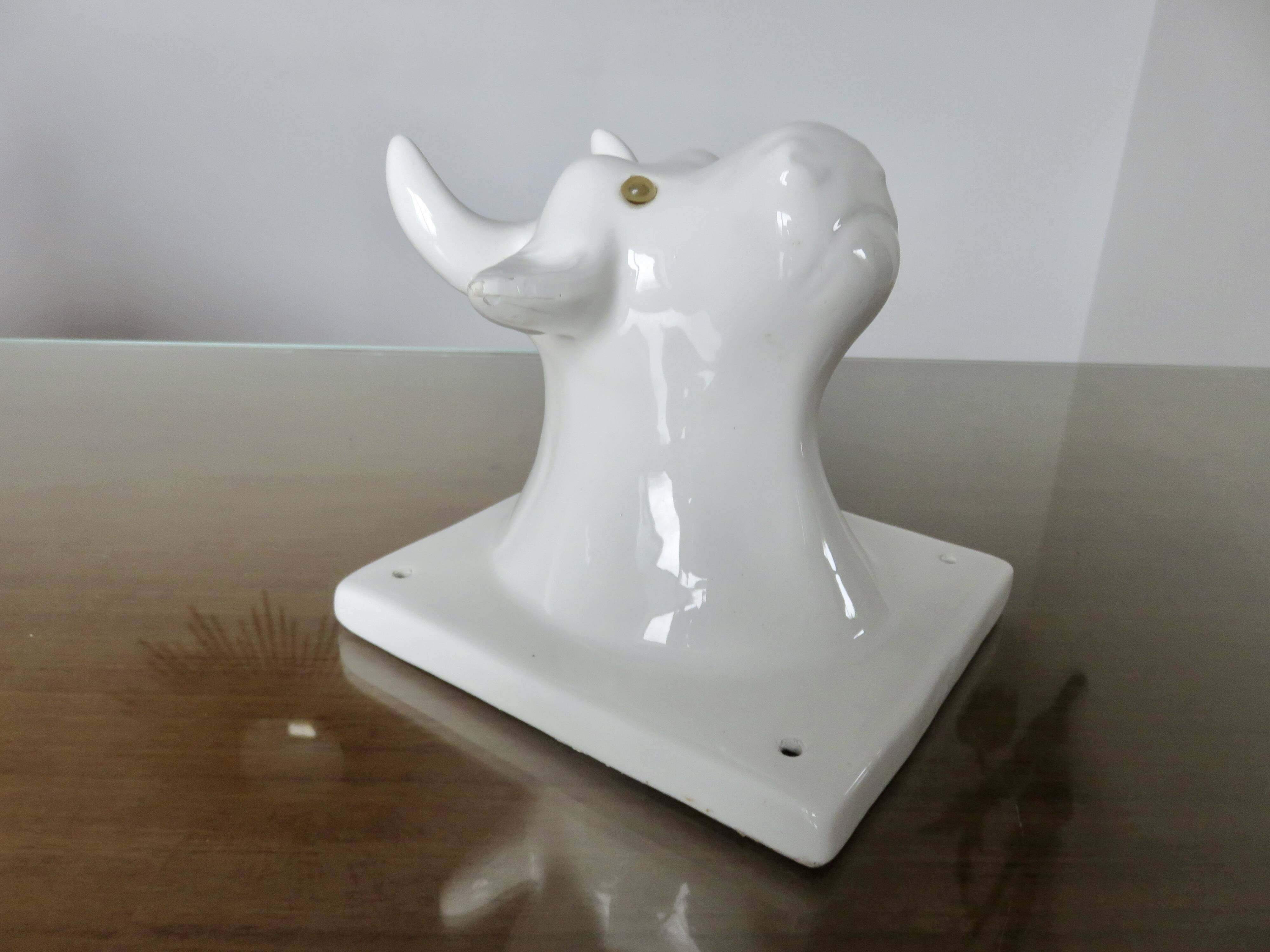Stylized cow head in white ceramic, wall decoration from the 80s