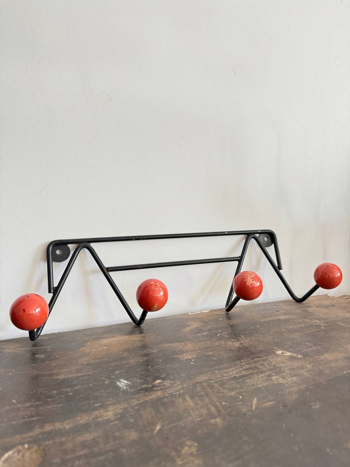 Wall coat rack with vintage red balls