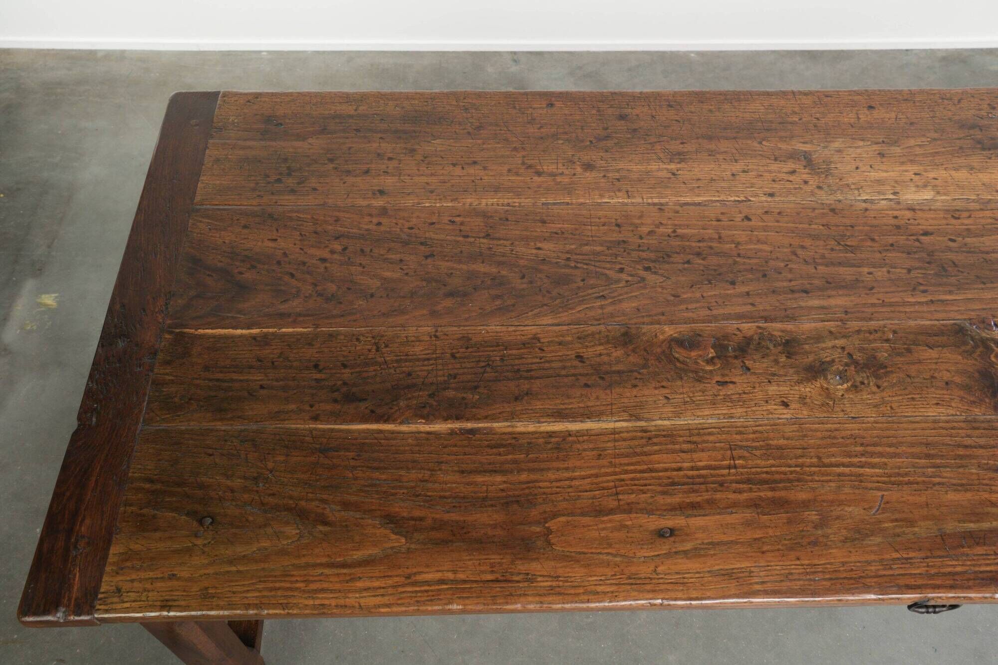 18th century French farmhouse dining table made of oak and fruitwood