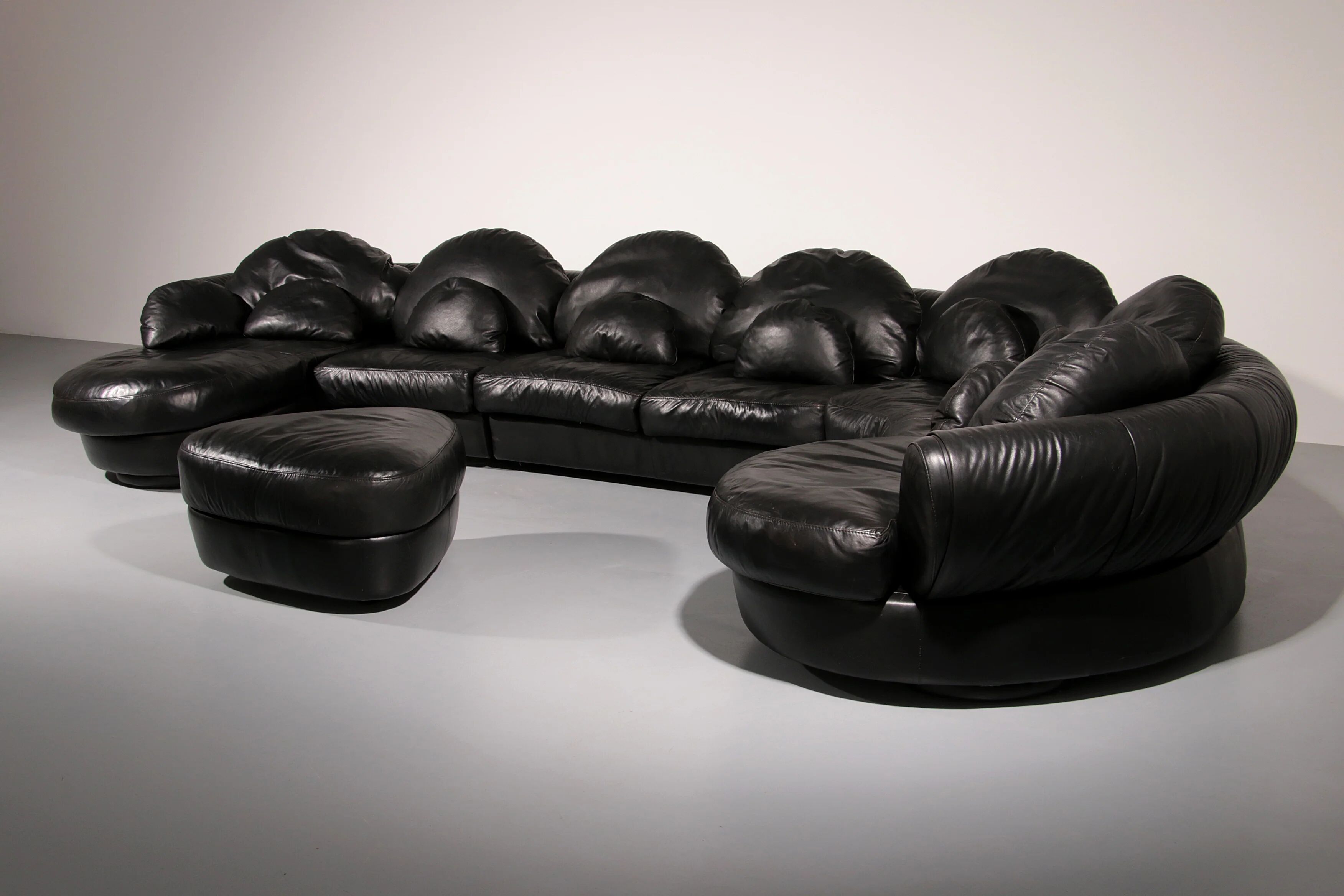 Organically shaped post-modern sectional sofa in black leather