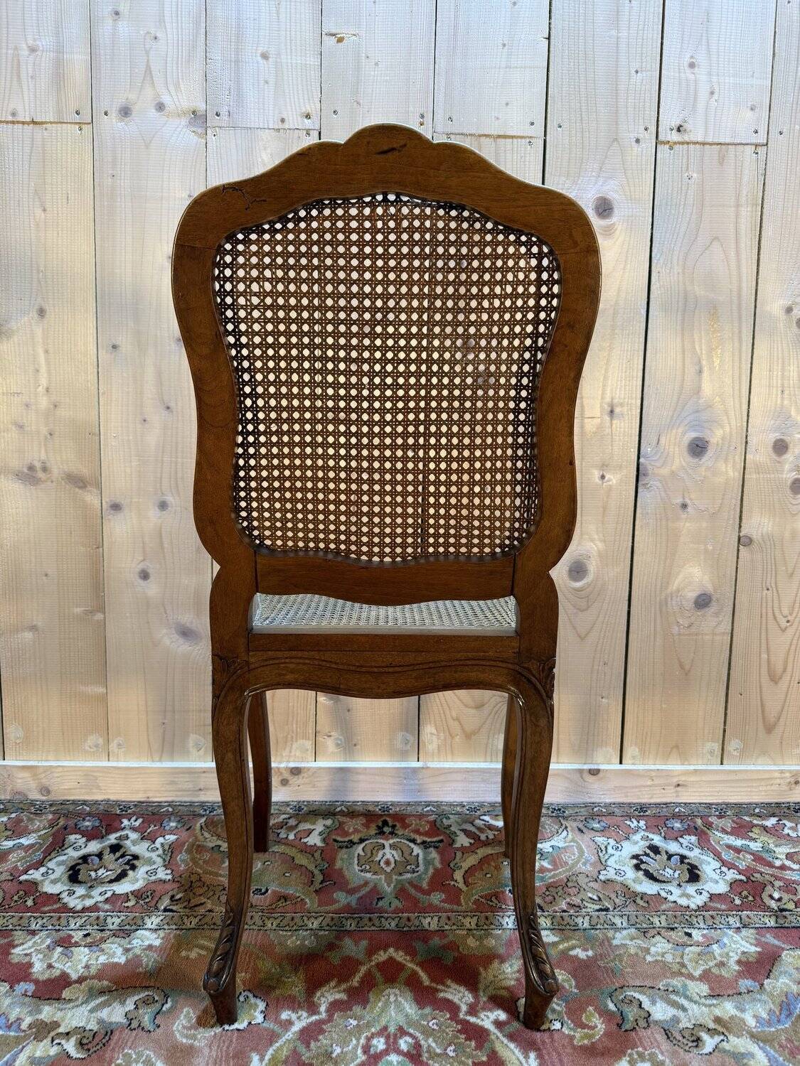 Set of 10 Louis XV style chairs in walnut and cane.